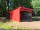 Red run-in shed offering shelter for livestock at 7866 Hwy 54, Sharpsburg, GA 30277