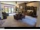 Spacious living room with fireplace, built-ins, and leather furniture at 7866 Hwy 54, Sharpsburg, GA 30277