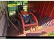 Orange tractor and various items stored in a barn at 7866 Hwy 54, Sharpsburg, GA 30277