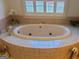 Bathroom features a large oval jacuzzi tub at 7866 Hwy 54, Sharpsburg, GA 30277