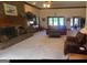 Open living room with fireplace and view of pool at 7866 Hwy 54, Sharpsburg, GA 30277