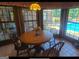 Bright breakfast nook with pool view and wood table at 7866 Hwy 54, Sharpsburg, GA 30277