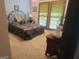 Bright bedroom with a plush carpet and large windows at 7866 Hwy 54, Sharpsburg, GA 30277