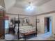 Main bedroom with a post bed and an ensuite bathroom at 7866 Hwy 54, Sharpsburg, GA 30277