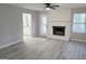 Living room boasts a stone fireplace and an open floor plan at 260 Pleasant Valley Rd, Mcdonough, GA 30253