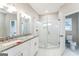 Modern bathroom with double vanity, granite countertop, and large shower at 1872 Oakmont Nw Dr, Atlanta, GA 30314
