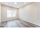 Bright bedroom with two windows and wood-look floors at 1872 Oakmont Nw Dr, Atlanta, GA 30314