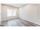 Bright bedroom with two windows and wood-look floors at 1872 Oakmont Nw Dr, Atlanta, GA 30314