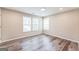 Spacious bedroom with neutral walls and hardwood floors at 1872 Oakmont Nw Dr, Atlanta, GA 30314