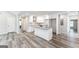 Modern kitchen with island and white shaker cabinets at 1872 Oakmont Nw Dr, Atlanta, GA 30314