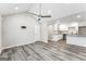 Open living room with vaulted ceilings and wood-look floors at 1872 Oakmont Nw Dr, Atlanta, GA 30314