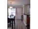 Bright dining area with hardwood floors and access to kitchen at 2628 Haligan Pointe, Riverdale, GA 30296