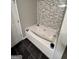Bathroom with a jetted tub and marble tile at 2628 Haligan Pointe, Riverdale, GA 30296