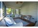 Relaxing screened porch with wicker furniture and a ceiling fan at 4130 Middlebrooks Ne St, Covington, GA 30014