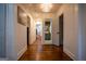 Bright hallway with hardwood floors and access to bedrooms and bathroom at 4130 Middlebrooks Ne St, Covington, GA 30014