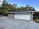 Two-car garage with a white door and a large driveway at 1904 Caribaea Se Trl, Atlanta, GA 30316