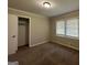 Spacious bedroom with neutral walls and large closet at 1904 Caribaea Se Trl, Atlanta, GA 30316