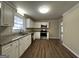 Updated kitchen with white cabinets and appliances at 1904 Caribaea Se Trl, Atlanta, GA 30316