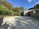 Large concrete patio, perfect for outdoor entertaining, adjacent to a wooded area at 1904 Caribaea Se Trl, Atlanta, GA 30316