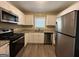Modern kitchen with stainless steel appliances and granite countertops at 1581 Hollyhock Ter, Decatur, GA 30032
