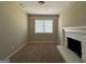 Cozy living room with a brick fireplace and neutral carpeting at 1581 Hollyhock Ter, Decatur, GA 30032