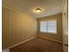 Bright bedroom with neutral carpeting and vertical paneling at 1581 Hollyhock Ter, Decatur, GA 30032