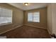 Spacious bedroom with neutral carpeting and dual windows at 1581 Hollyhock Ter, Decatur, GA 30032