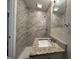 Clean bathroom with granite vanity and marble-tiled shower at 1581 Hollyhock Ter, Decatur, GA 30032