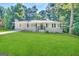 Charming ranch house with a well-maintained lawn at 1581 Hollyhock Ter, Decatur, GA 30032