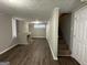 Finished basement with fireplace and laminate flooring at 2019 W Flat Shoals Ter, Decatur, GA 30034