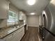 Modern kitchen featuring granite countertops and stainless steel appliances at 2019 W Flat Shoals Ter, Decatur, GA 30034