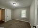Simple bedroom with neutral walls and carpet flooring at 2019 W Flat Shoals Ter, Decatur, GA 30034
