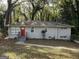 Brick ranch home with red door and green lawn at 2019 W Flat Shoals Ter, Decatur, GA 30034