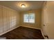Simple bedroom with wood-look floors and window at 1370 David Cir, Decatur, GA 30032