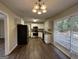 Modern kitchen with white cabinets, granite countertops, and stainless steel appliances at 1370 David Cir, Decatur, GA 30032
