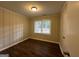 Simple bedroom with wood-look floors and window at 1370 David Cir, Decatur, GA 30032