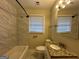 Clean bathroom with tile shower/tub and granite vanity at 1370 David Cir, Decatur, GA 30032