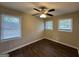 Bright bedroom with wood-look floors and two windows at 1370 David Cir, Decatur, GA 30032