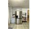 Kitchen features stainless steel refrigerator and ample cabinetry at 6091 Katherine Rd, Rex, GA 30273