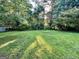 Spacious backyard with lush green grass, offering a tranquil outdoor space at 6091 Katherine Rd, Rex, GA 30273