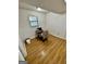 Simple bedroom with hardwood floors and window at 6091 Katherine Rd, Rex, GA 30273