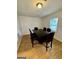 Dining room with dark wood table and six leather chairs at 6091 Katherine Rd, Rex, GA 30273