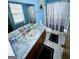 Bathroom with marble countertop and shower at 6091 Katherine Rd, Rex, GA 30273