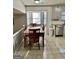 Dining area with wood table and chairs, adjacent to kitchen at 6091 Katherine Rd, Rex, GA 30273