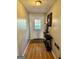 Bright entryway with hardwood floors and decorative console table at 6091 Katherine Rd, Rex, GA 30273