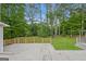 Large backyard with deck and mature trees at 2090 Blackberry Ln, Auburn, GA 30011