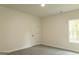 Spacious bedroom with neutral walls and plush carpeting at 5960 Old Timber Trl # 17, Douglasville, GA 30135