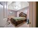 Spacious main bedroom with large bed and ceiling fan at 992 Cove Lake Ct, Lawrenceville, GA 30045