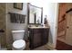 Small bathroom with granite vanity and toilet at 900 Eskew Rd, Mcdonough, GA 30252