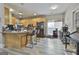 Kitchen with light wood cabinets, granite countertops, and a breakfast bar at 105 St Albans Way, Peachtree City, GA 30269